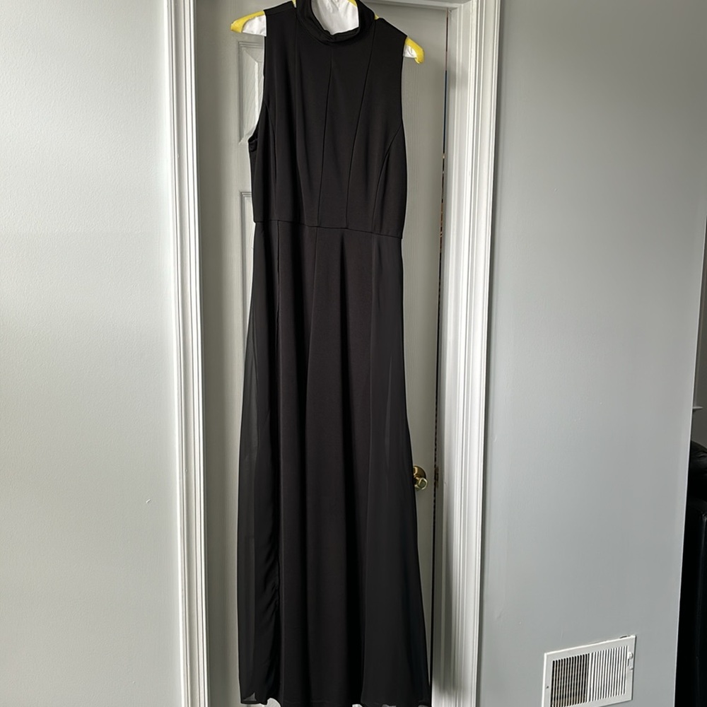Women’s jumpsuit with glowing chiffon cape in the back.